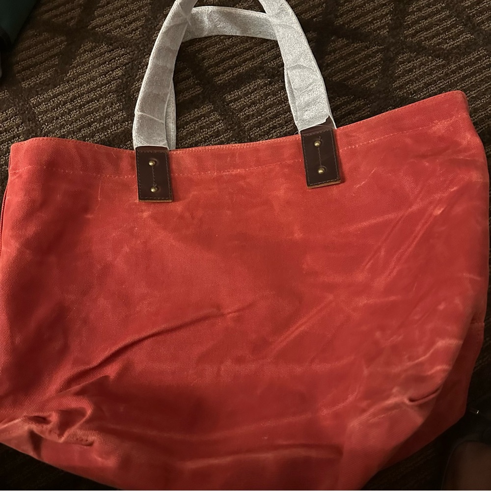 L.L. Bean Red   rugged Canvas Tote with and Brown handals  never used.